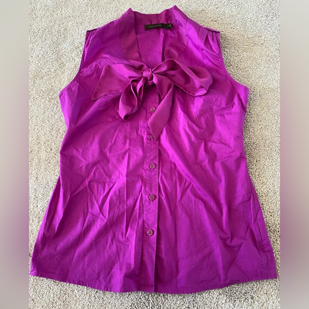 Pop of color! Pink/magenta blouse with tie at neck.